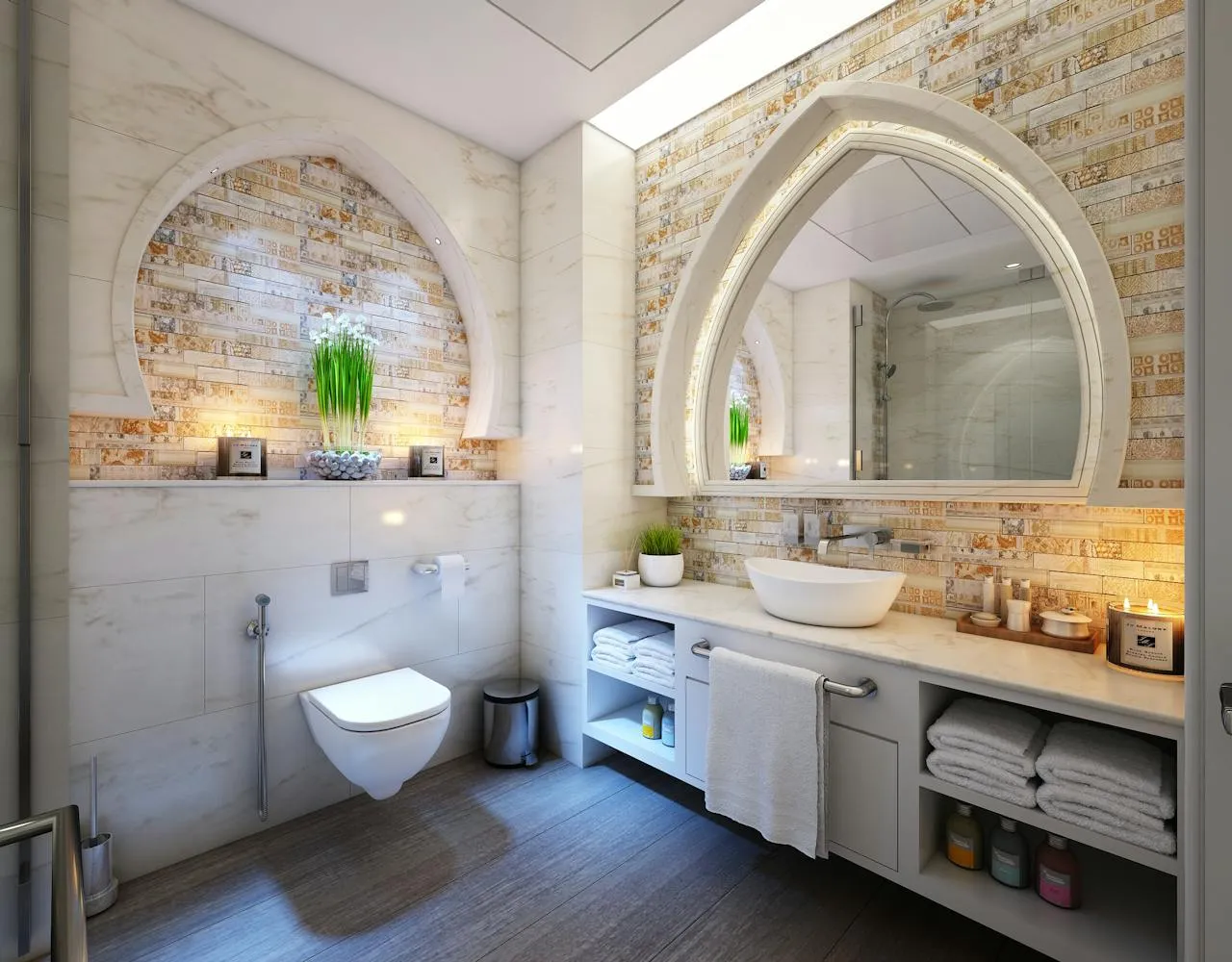 Bathroom with a tiled wall, oval mirror, and vanity storage